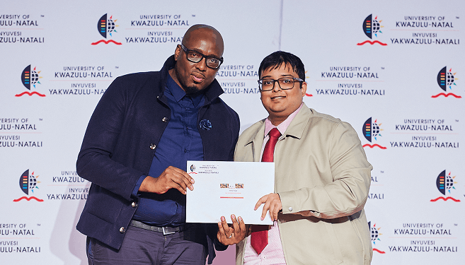 Mr Vidhan Singh (right) receives his award from Professor Ernest Khalema, DVC and Head: College of Law and Management Studies.
